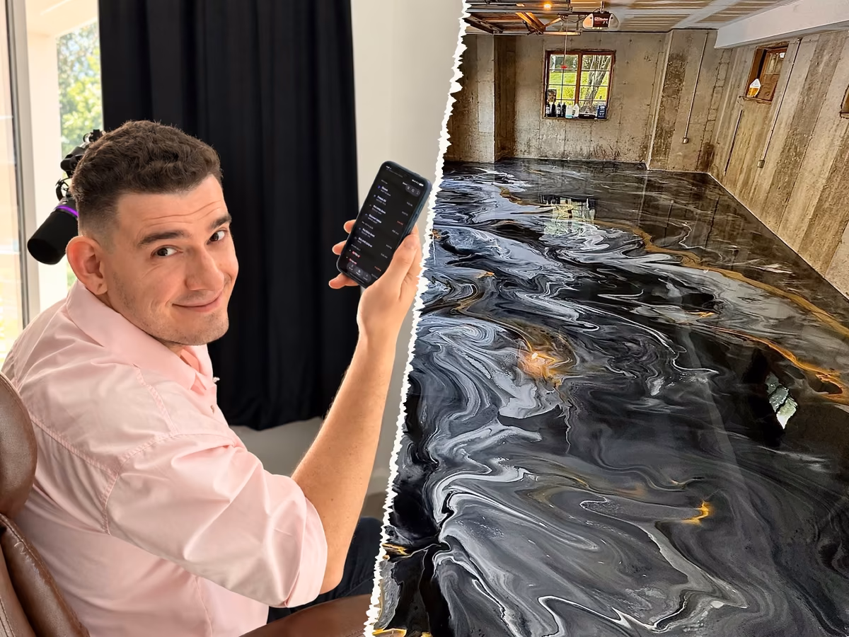 Eddie A. holding up his phone next to a garage with a glossy metallic epoxy floor