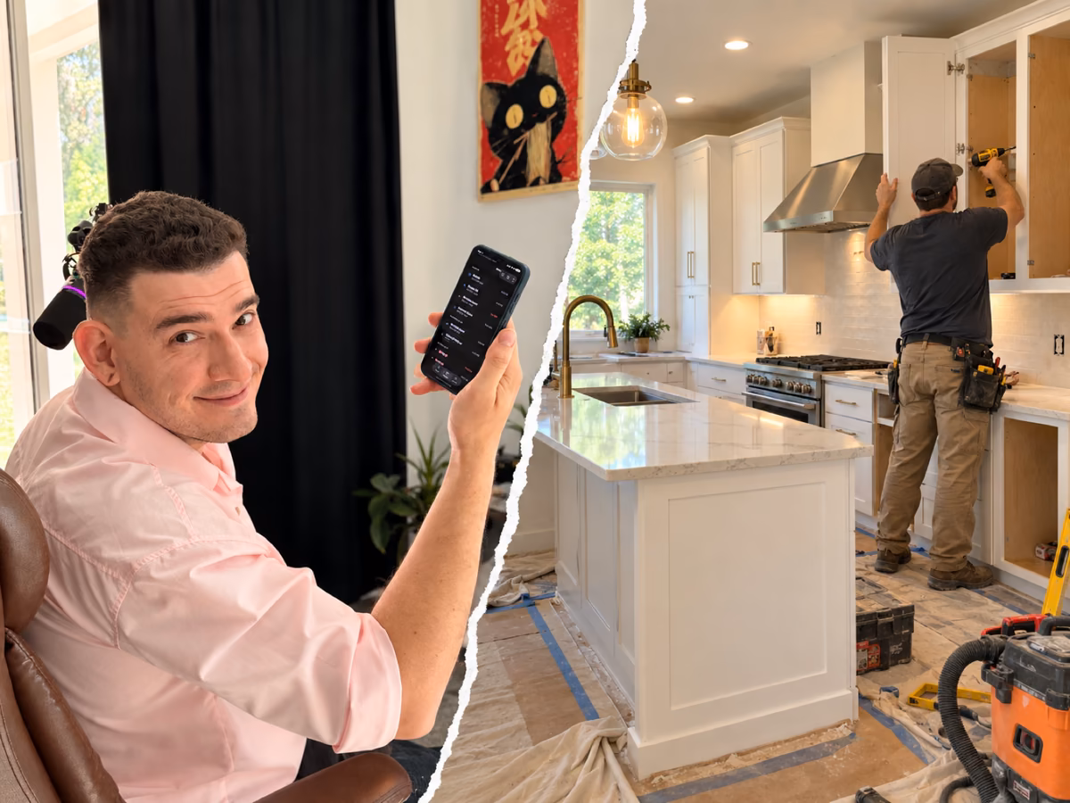 Eddie A. holding up his phone next to a contractor installing new white kitchen cabinets